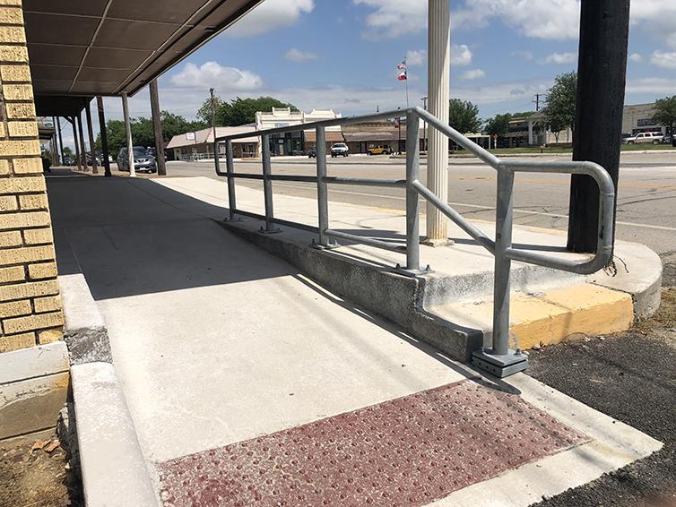 pedestrian handrails and detectable warning surface ramp
